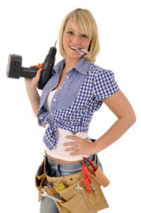 Craftswoman with cordless screwdriver
